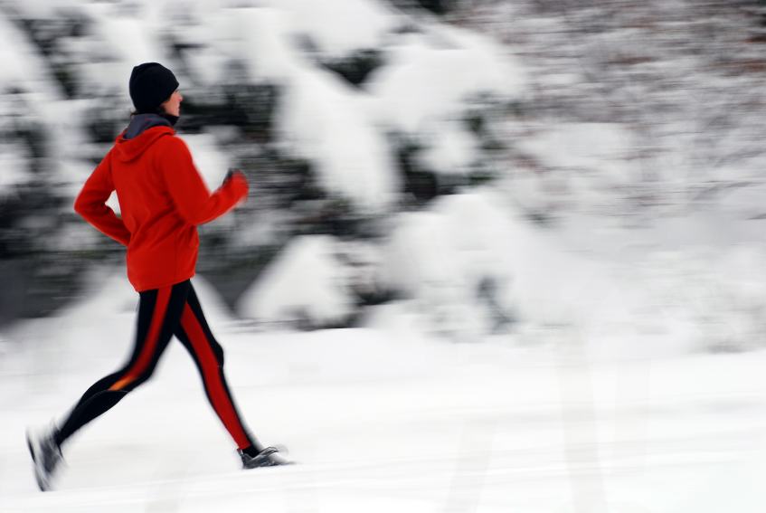 Woman Running In Snow